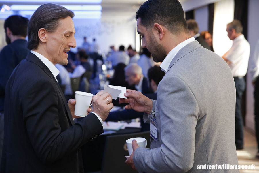 Exchanging business cards at conference