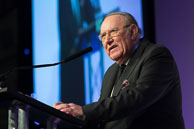 Photography of Andrew Neil giving a keynote speech