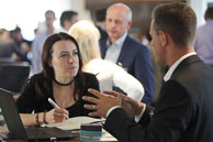 Photography of delegate interaction at conference